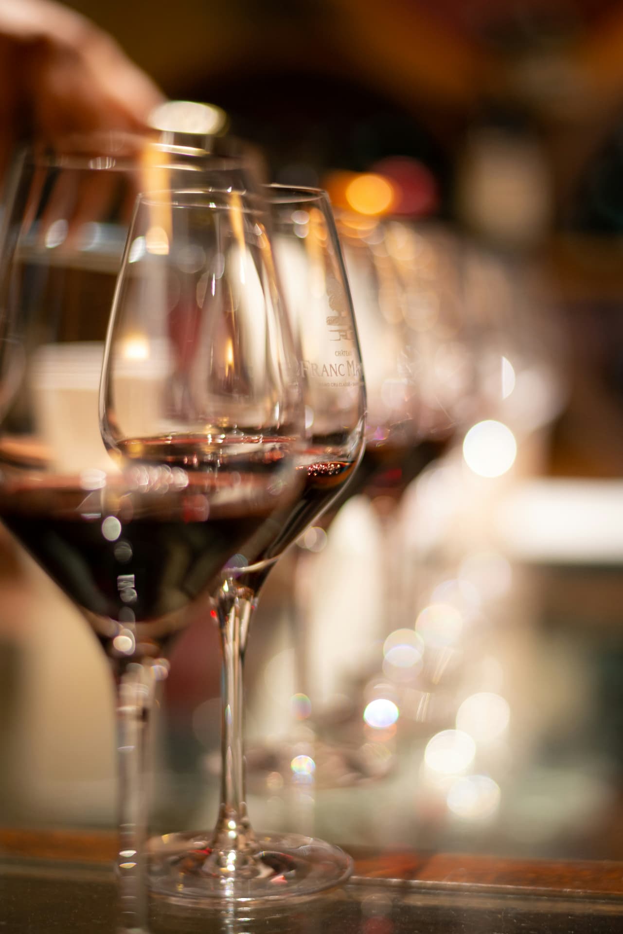 Glasses of red wine in soft focus